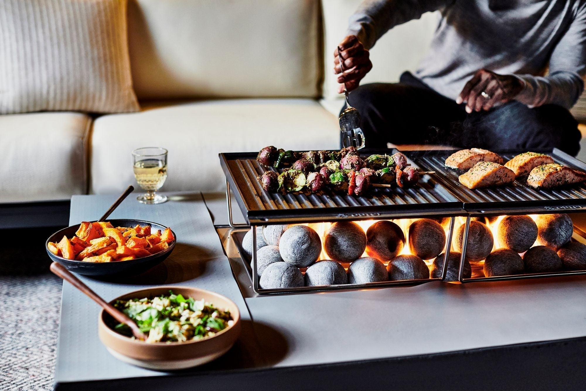 a man enjoy BBQ in fire pit table https://liveouter.com/