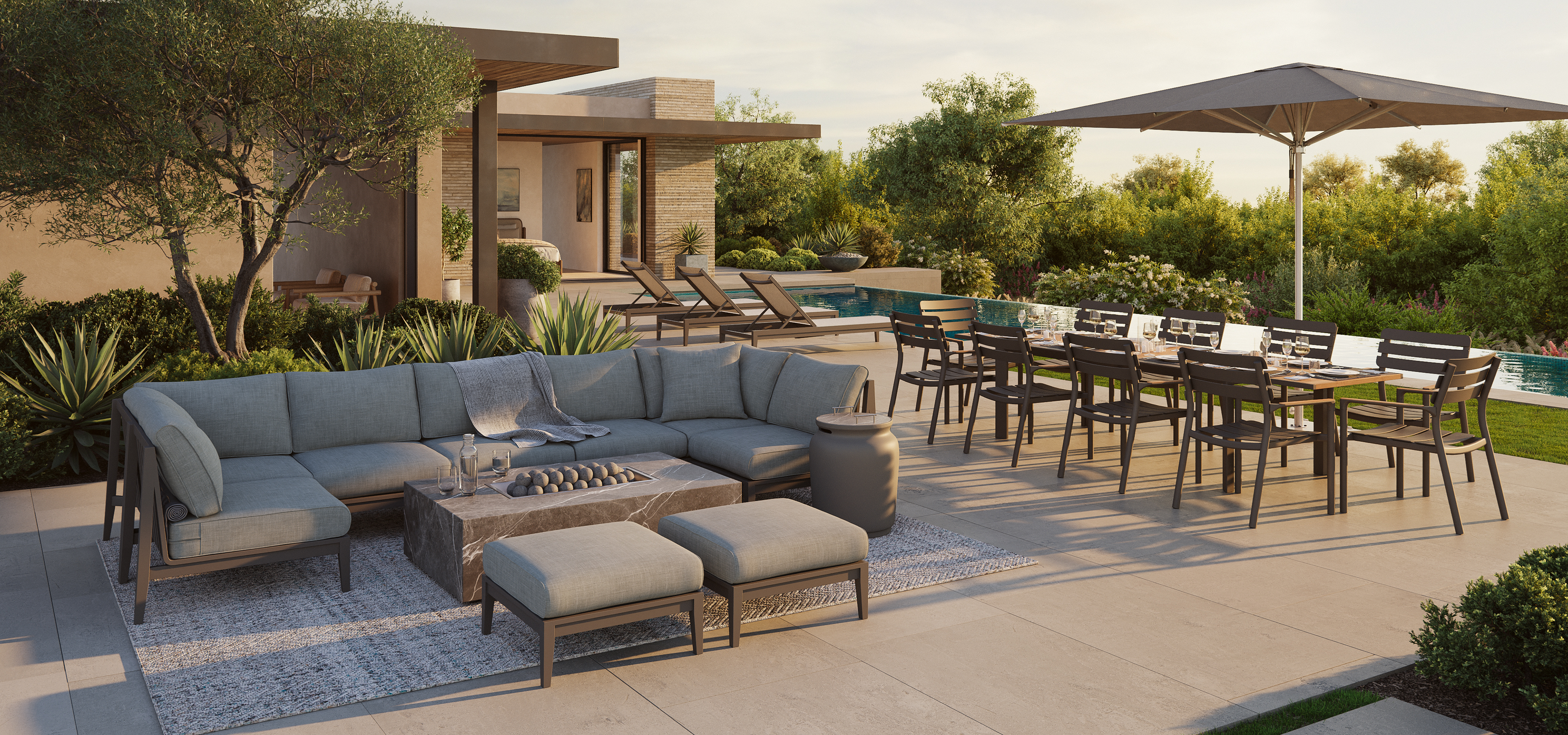 Modern outdoor patio with sectional sofa, fire pit table, and large outdoor dining set under an umbrella