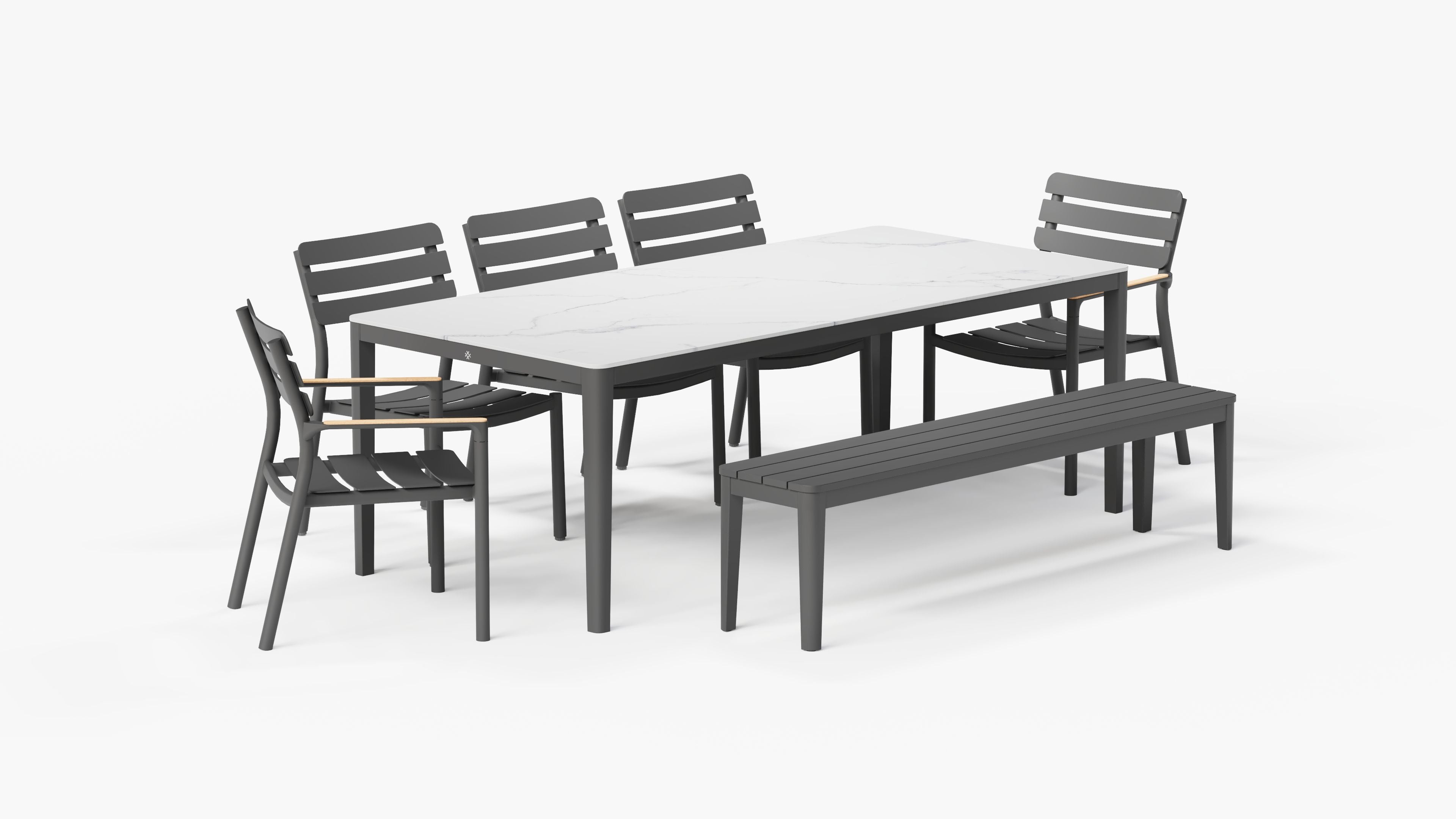 OuterStone Dining Table in Glacier White with 3 595 Armless Chairs, 2 595 Armchairs, and 1 bench, 3/4 view.