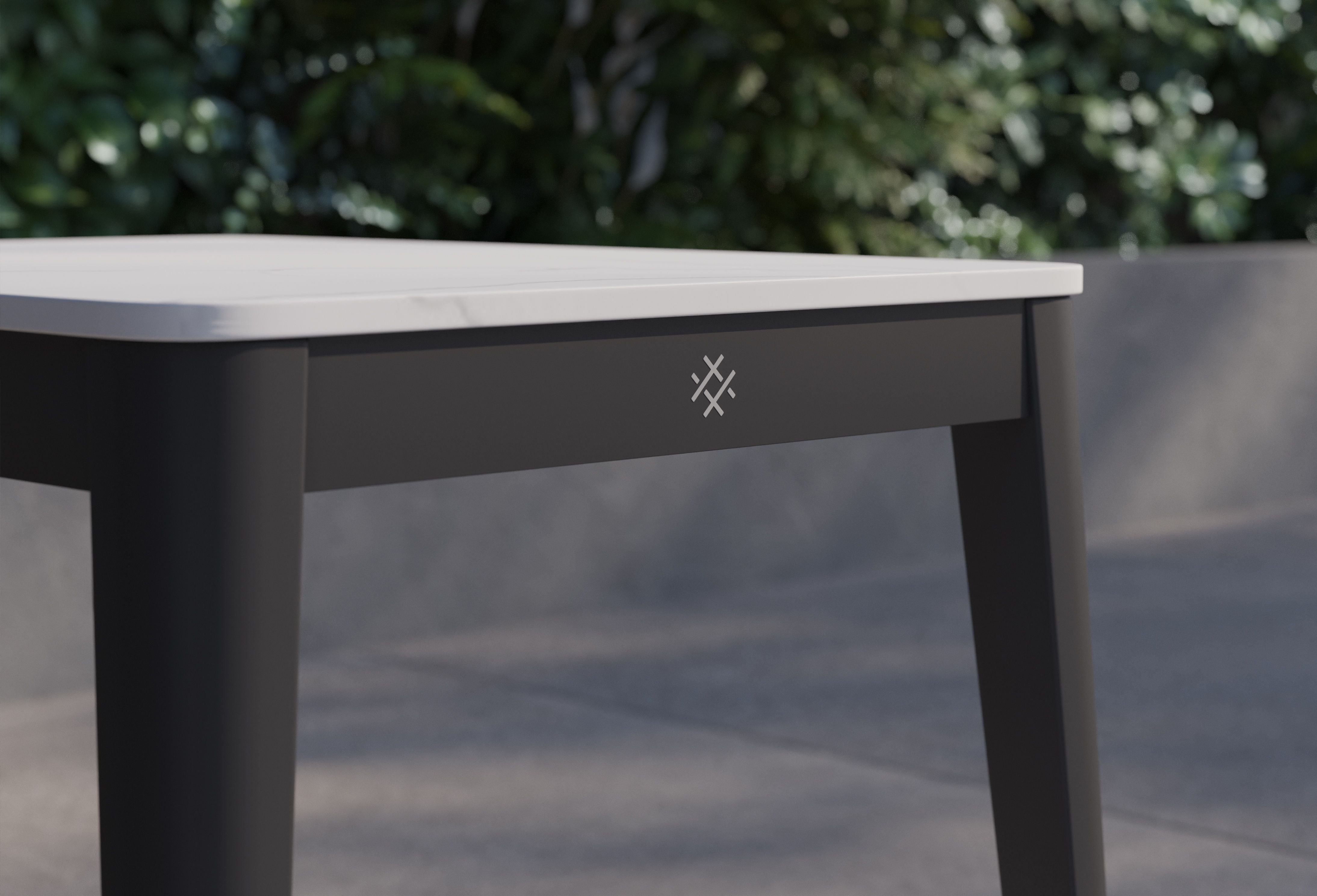 Closeup of the OuterStone side table showing OuterLogo detail. #color_glacier white