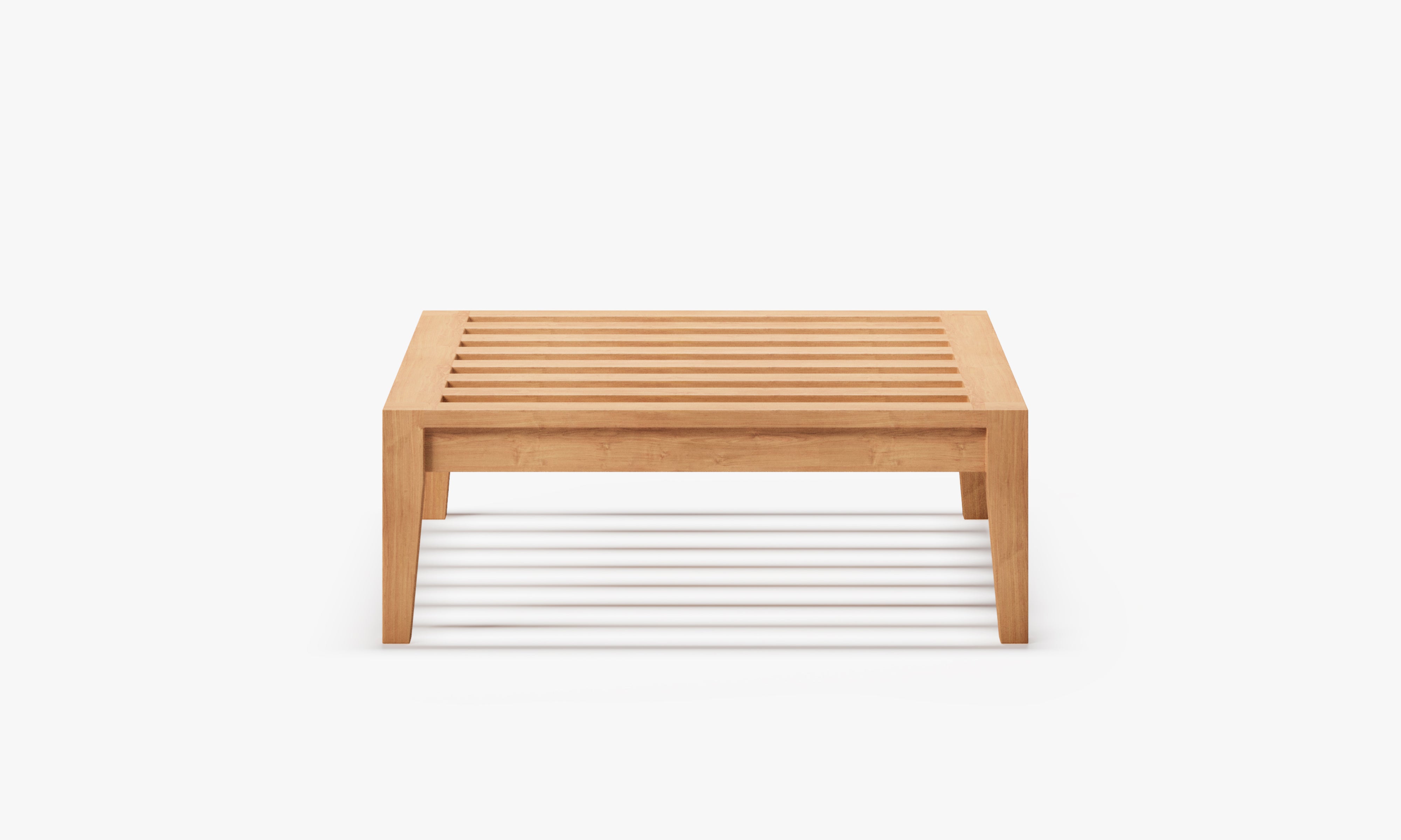 Front view of a solid teak ottoman frame with slatted top, minimalist rectangular structure, and natural wood finish, isolated on a clean white background to emphasize form and material