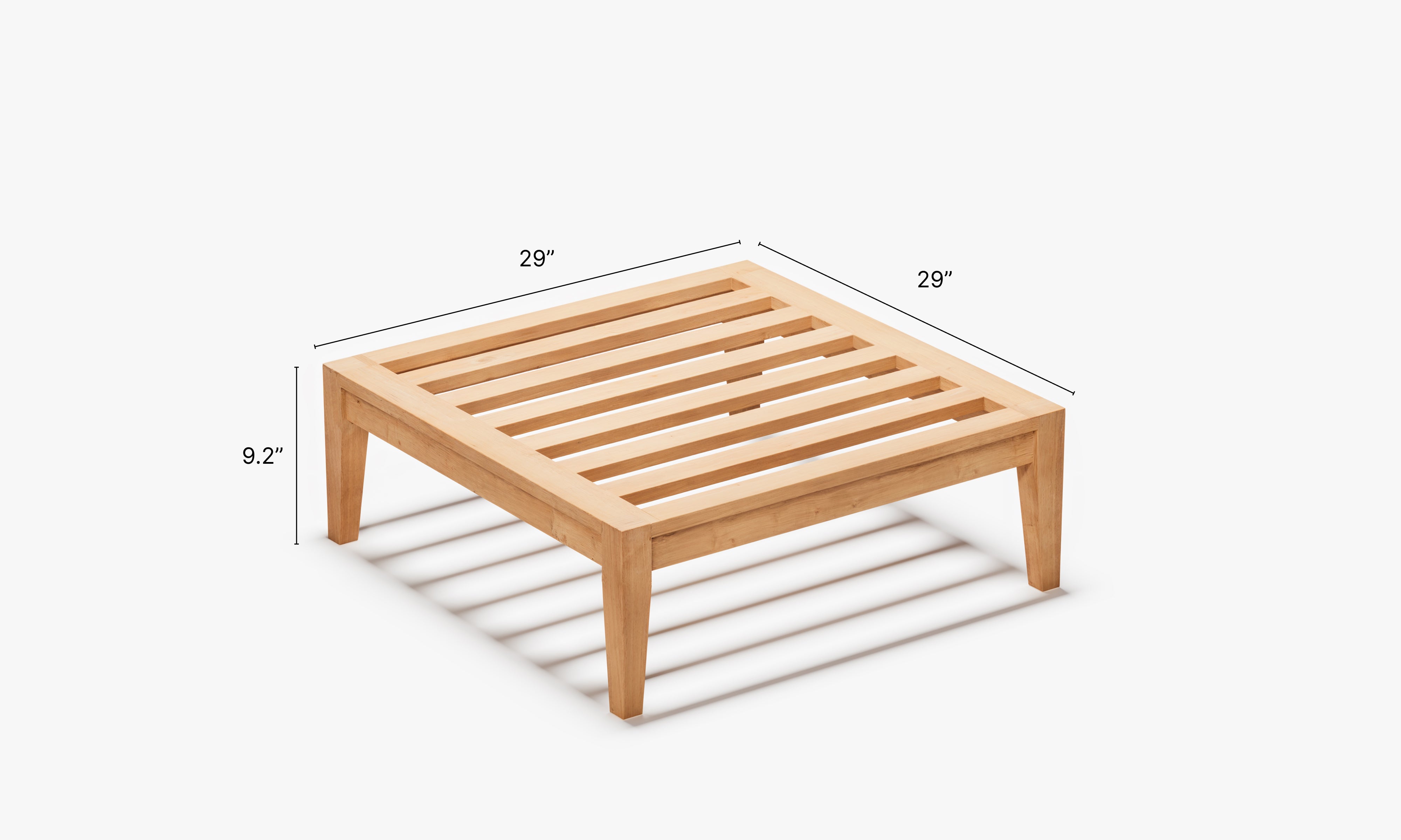 Solid teak ottoman frame with slatted top design, displayed in angled view with dimension markings (29" length, 29" width, 9.2" height), emphasizing compact size, structural clarity, and natural wood finish