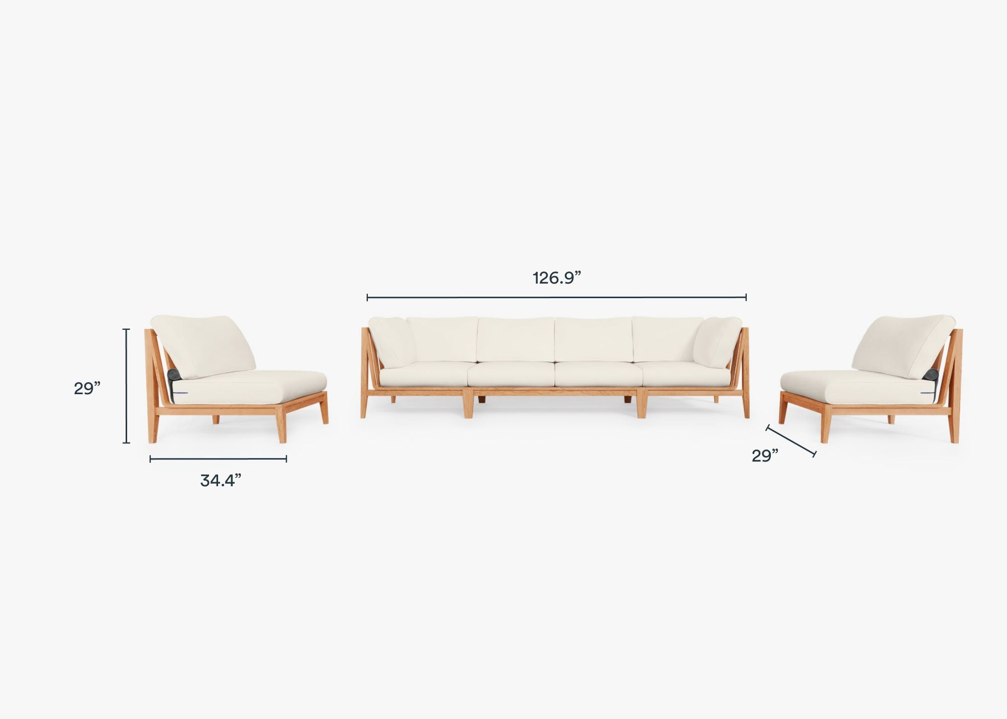A teak outdoor sofa with armless design, featuring white cushions and a natural wood frame, placed on a wooden deck with greenery in the background.-teak outdoor sofa-outer #color_palisades cream