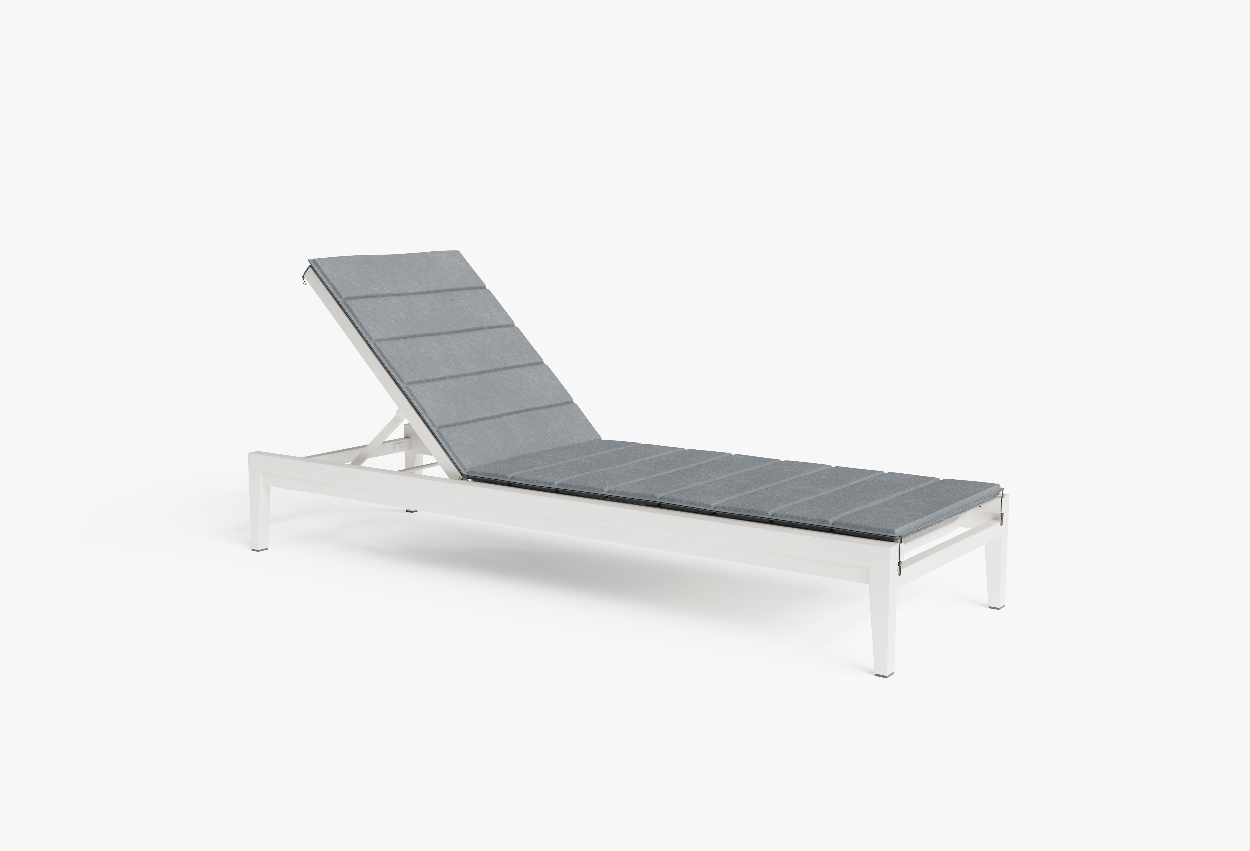 The optional OuterWeave cushion on the white chaise lounge in pacific fog gray. #color_pacific fog gray