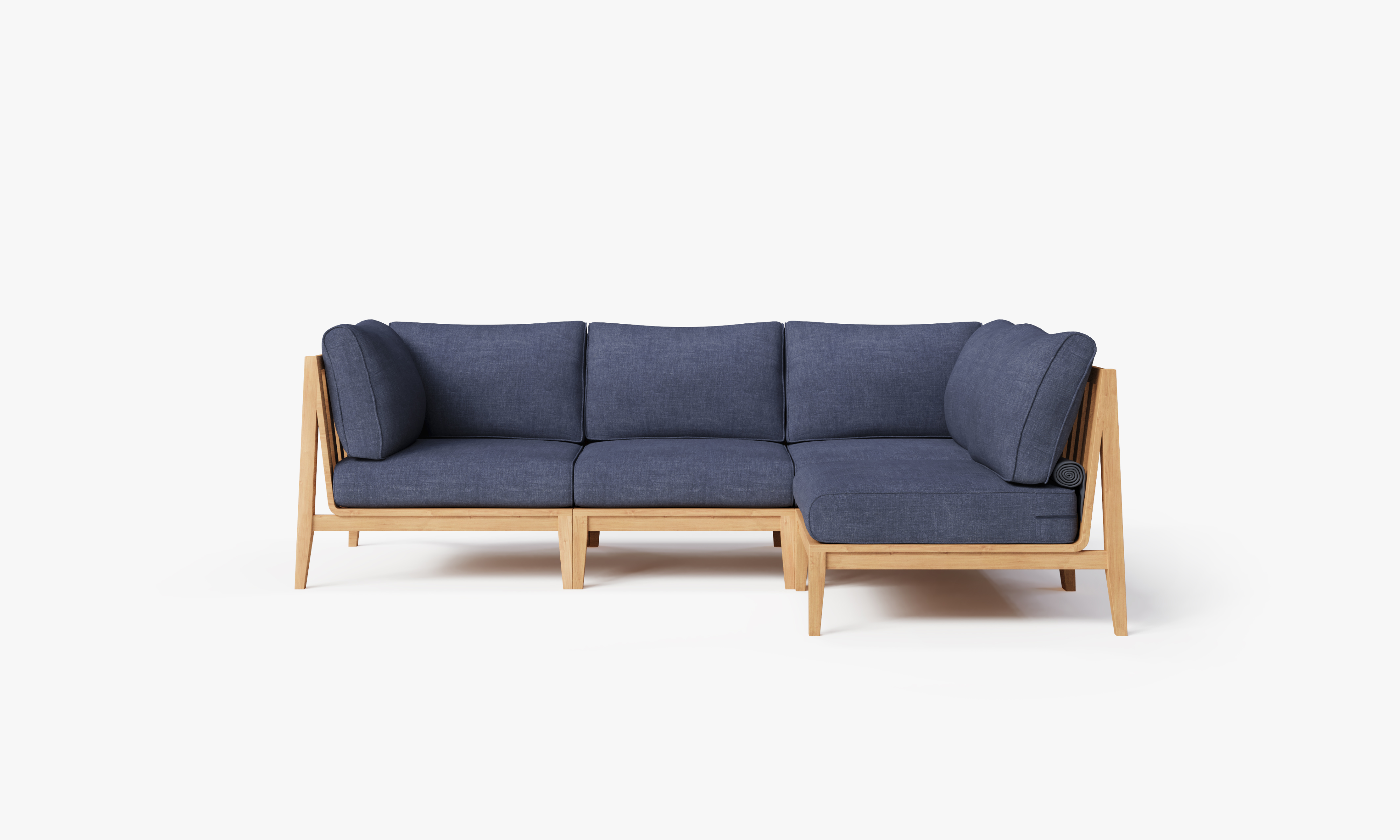 Teak outdoor L sectional sofa with 4 navy cushions arranged in an L shape on a wooden deck.-teak outdoor sofa-outer #color_deep sea navy