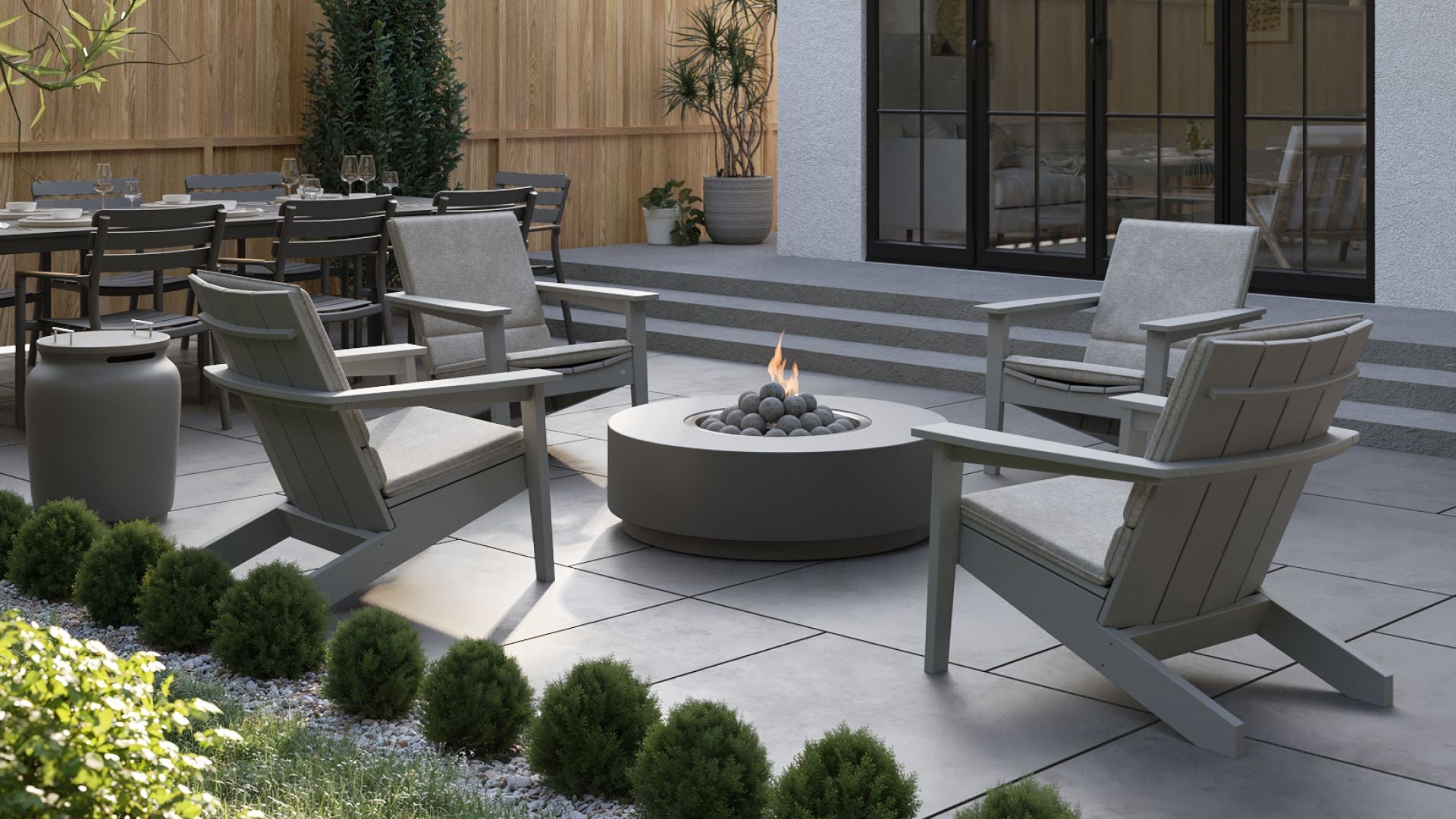 Adirondack chairs arranged around a fire pit for conversation and comfort