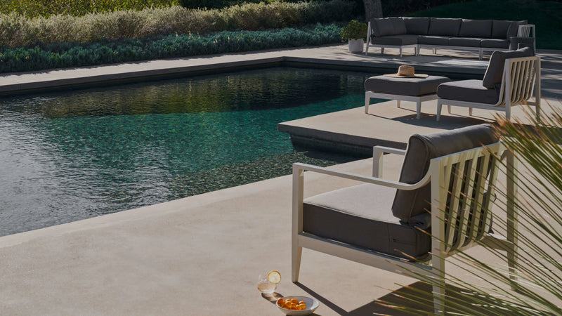 White powder-coated aluminum Outer outdoor sofa beside a swimming pool
