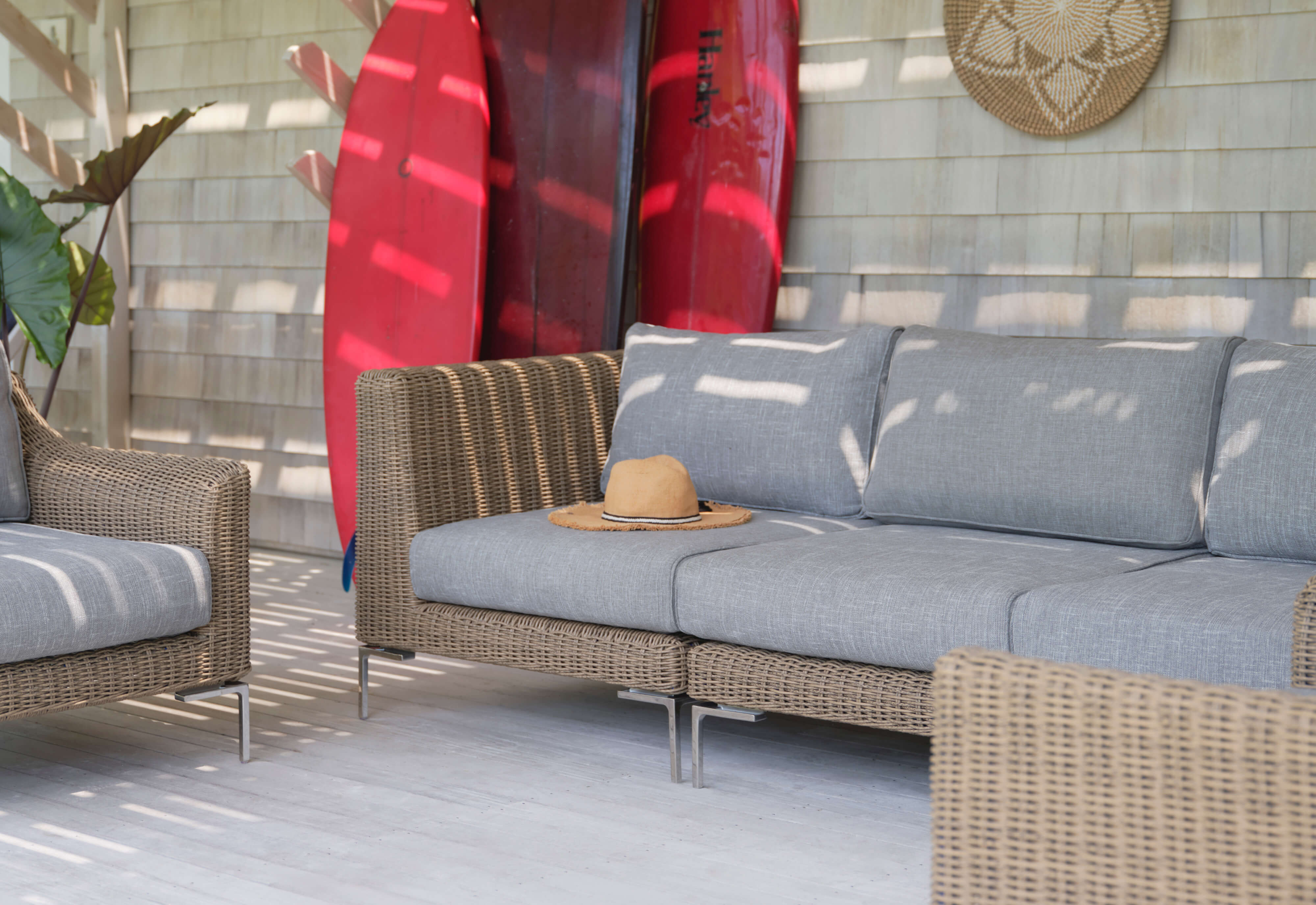 The brown all-weather wicker outdoor 3-piece sofa with pacific fog gray cushions and matching armchairs. #color_pacific fog gray